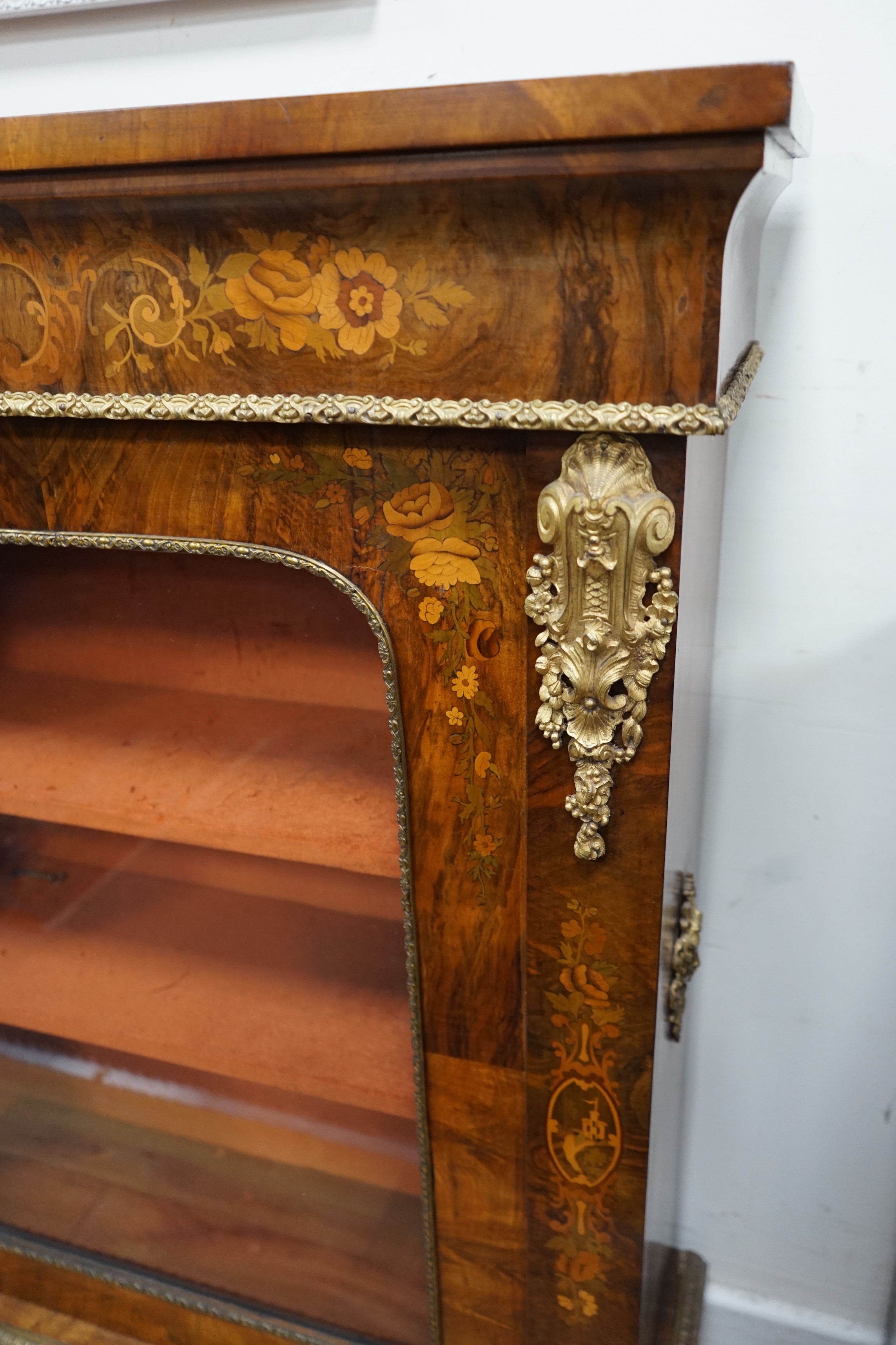 A Victorian ormolu mounted walnut and marquetry pier cabinet, width 84cm, depth 30cm, height 112cm